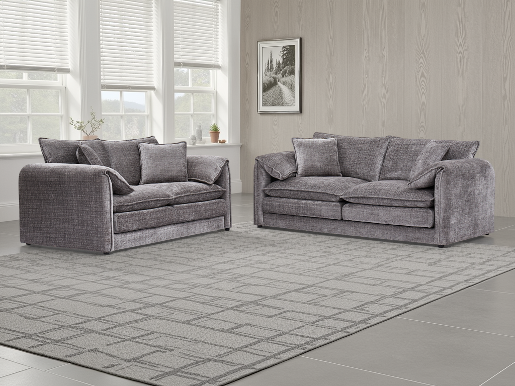 Two gray sofas in a room with large windows and a framed picture on the wall.