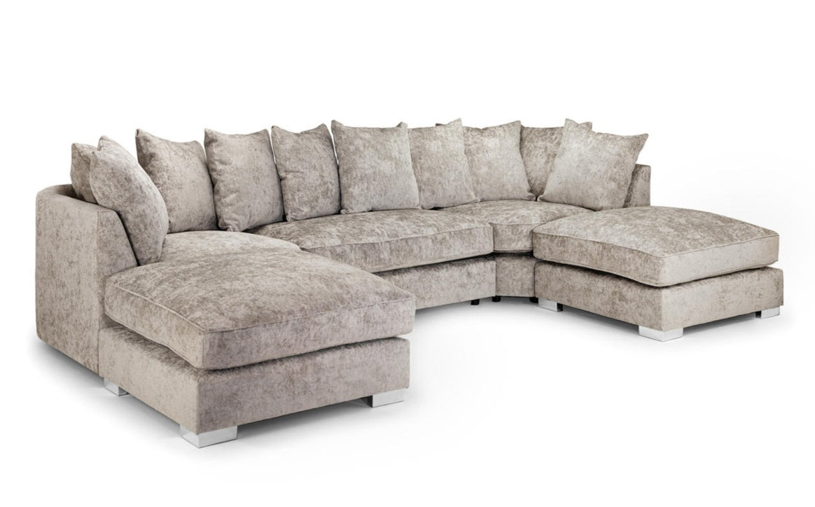 A light beige textured fabric sectional sofa with a left-facing chaise lounge and multiple matching back cushions, shown on a plain white background.